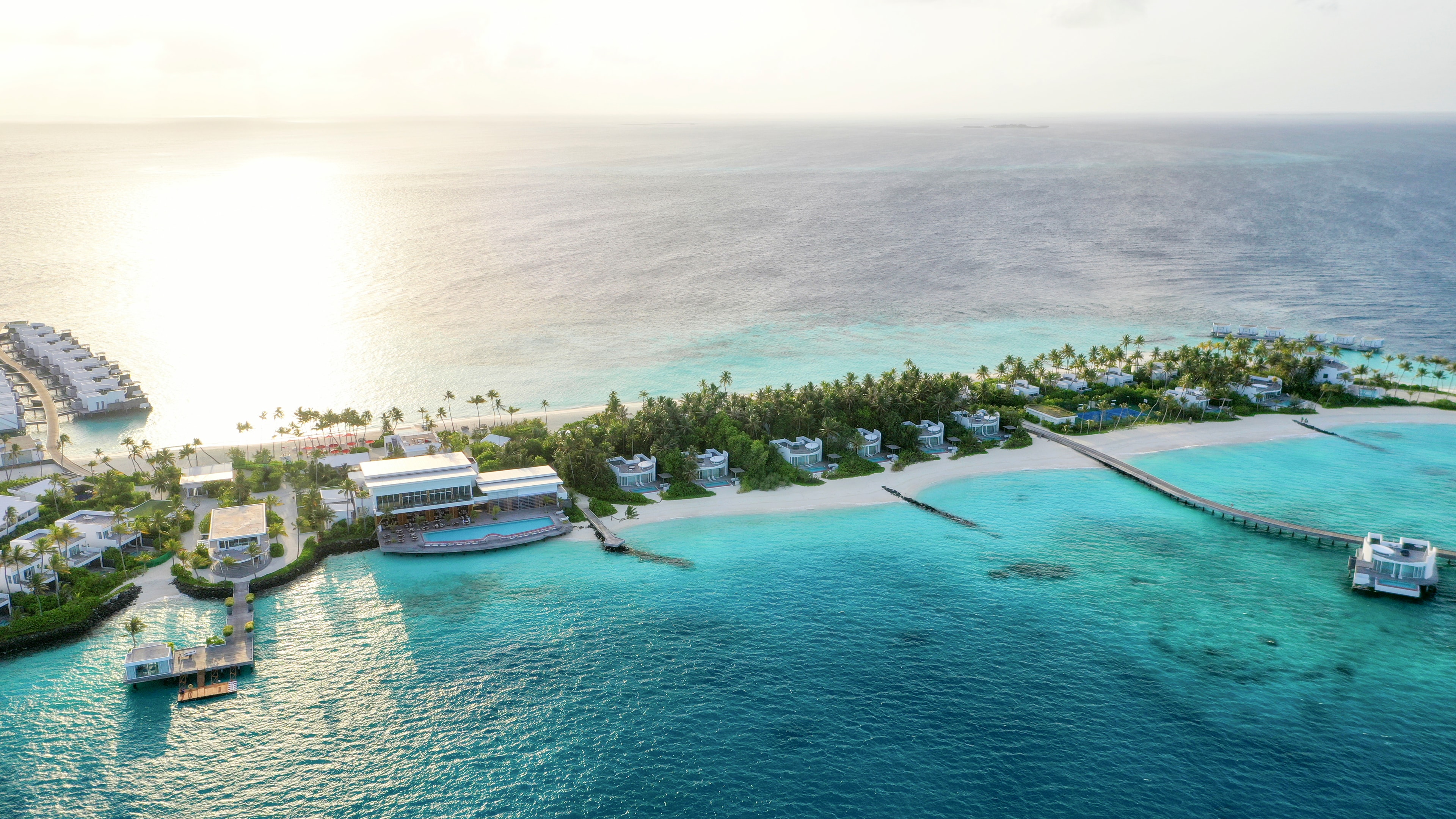 Jumeirah Maldives beach villas aerial view turquoise waters