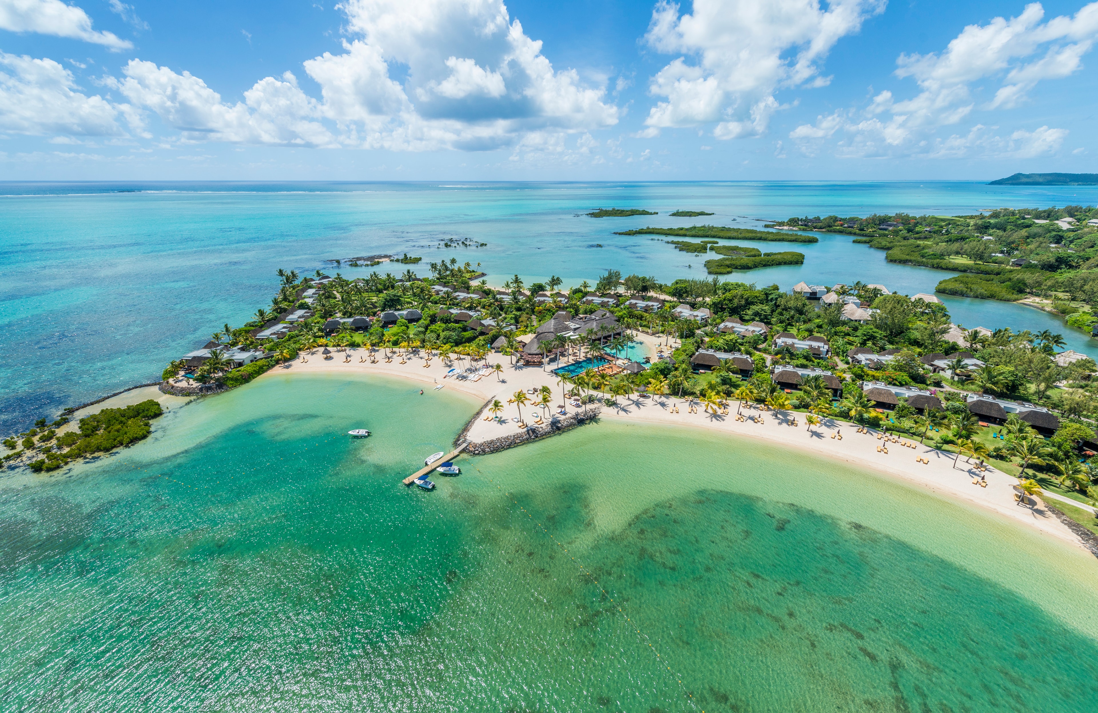 Aerial view of luxury tropical resort island with white sand beach and turquoise waters, Mauritius